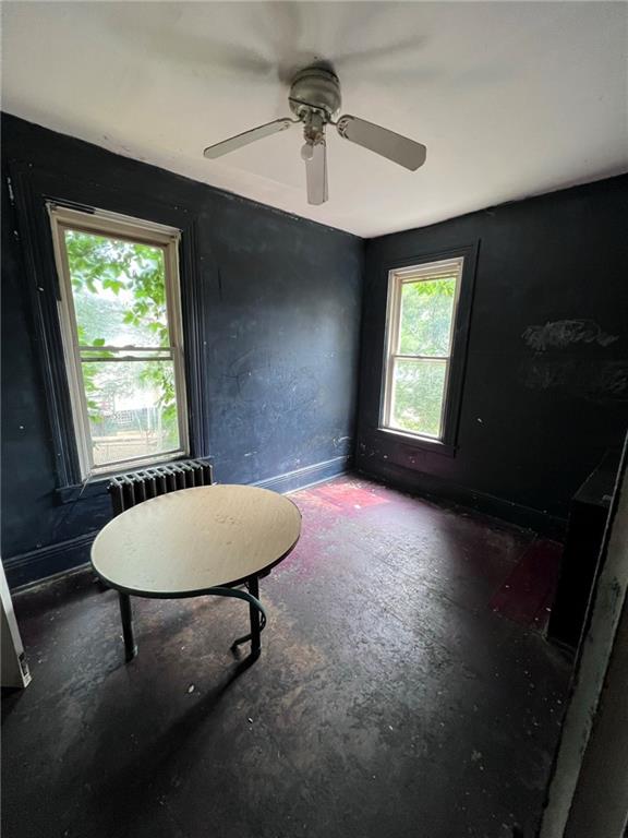 137 Zara Street Pittsburgh, PA 15210 - Photo 6 of 12 a room with a window and a chandelier