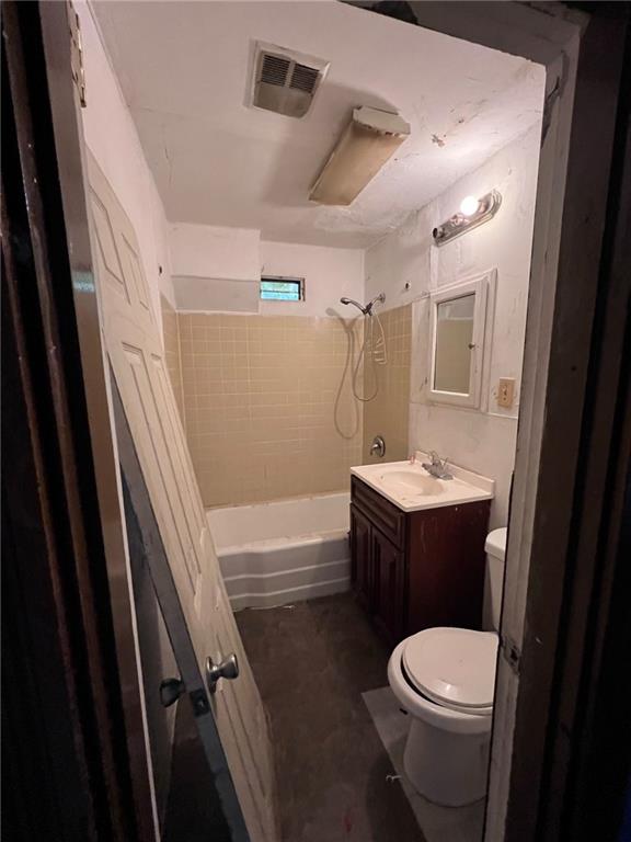 137 Zara Street Pittsburgh, PA 15210 - Photo 7 of 12 a bathroom with a sink a toilet a mirror and vanity