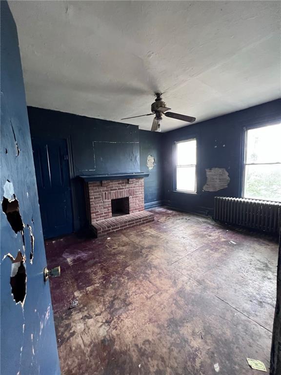 137 Zara Street Pittsburgh, PA 15210 - Photo 9 of 12 a view of empty room with a fireplace
