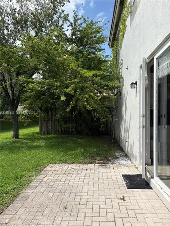 a view of backyard with green space