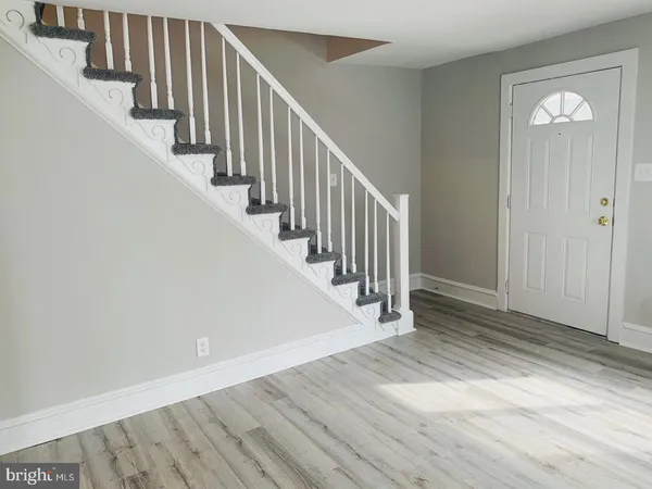 a view of entryway with wooden floor