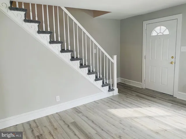 a view of entryway with wooden floor