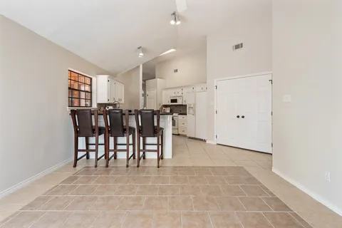 a view of kitchen with furniture and window