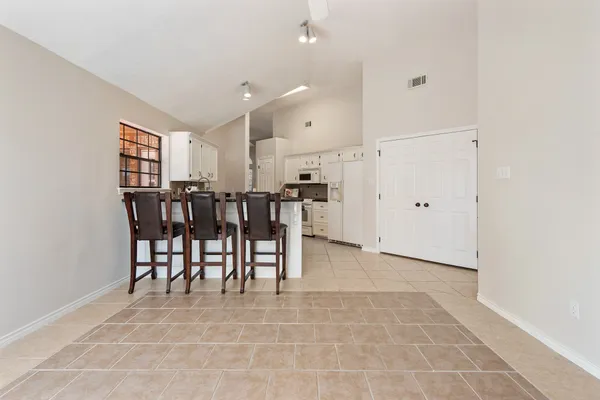 a view of kitchen with furniture and window