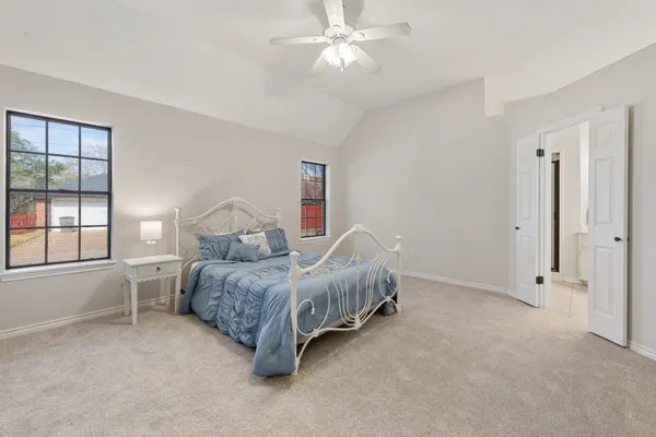 a bed room with a bed and a window