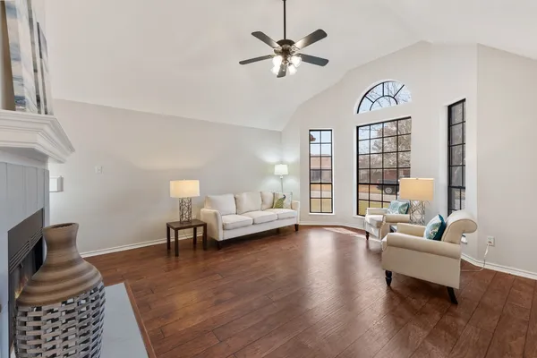 a living room with furniture and a large window
