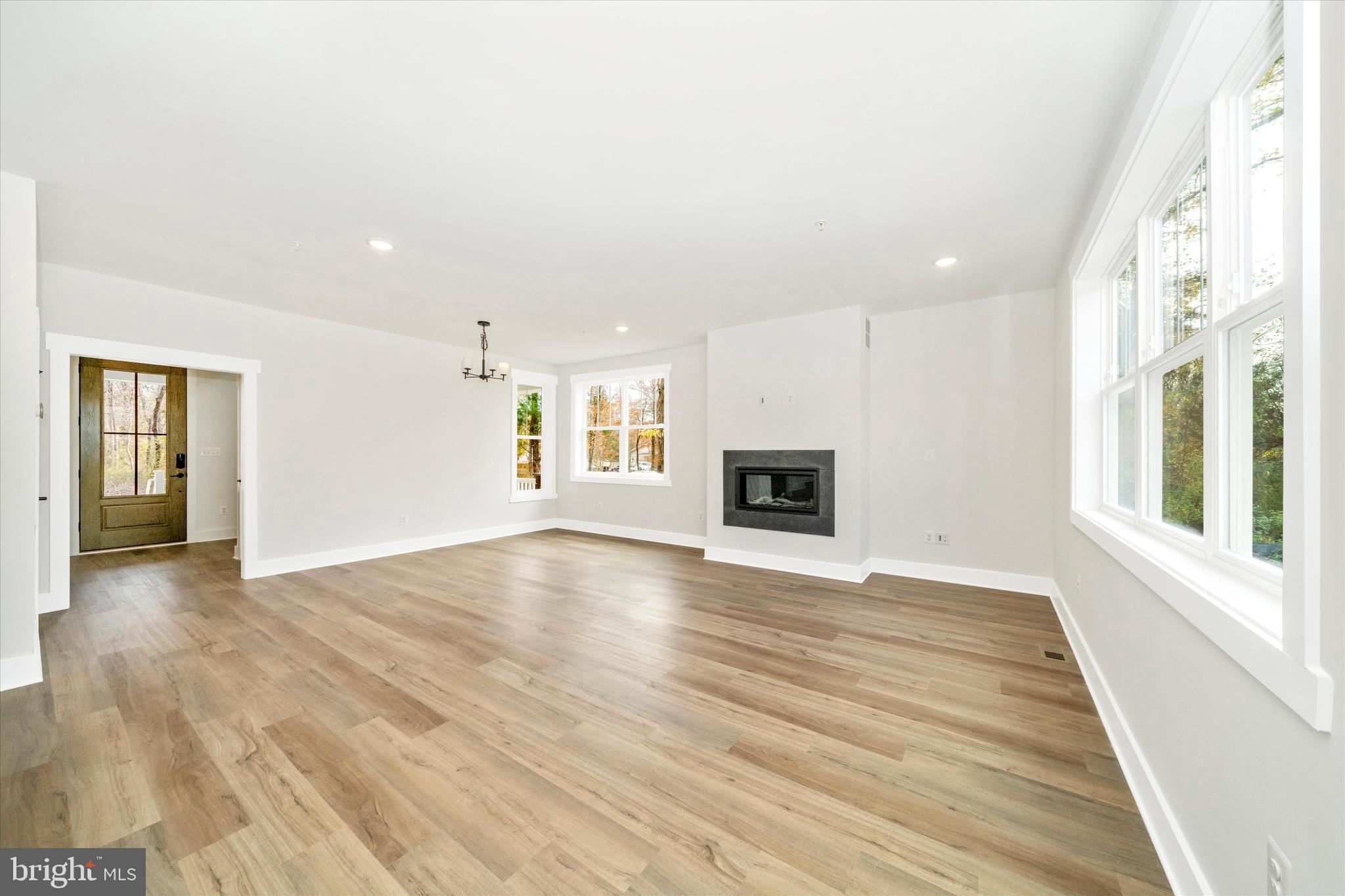 1154 Mt Zion Marlboro Road Lothian, MD 20711 - Photo 13 of 66 a view of an empty room with window and wooden floor