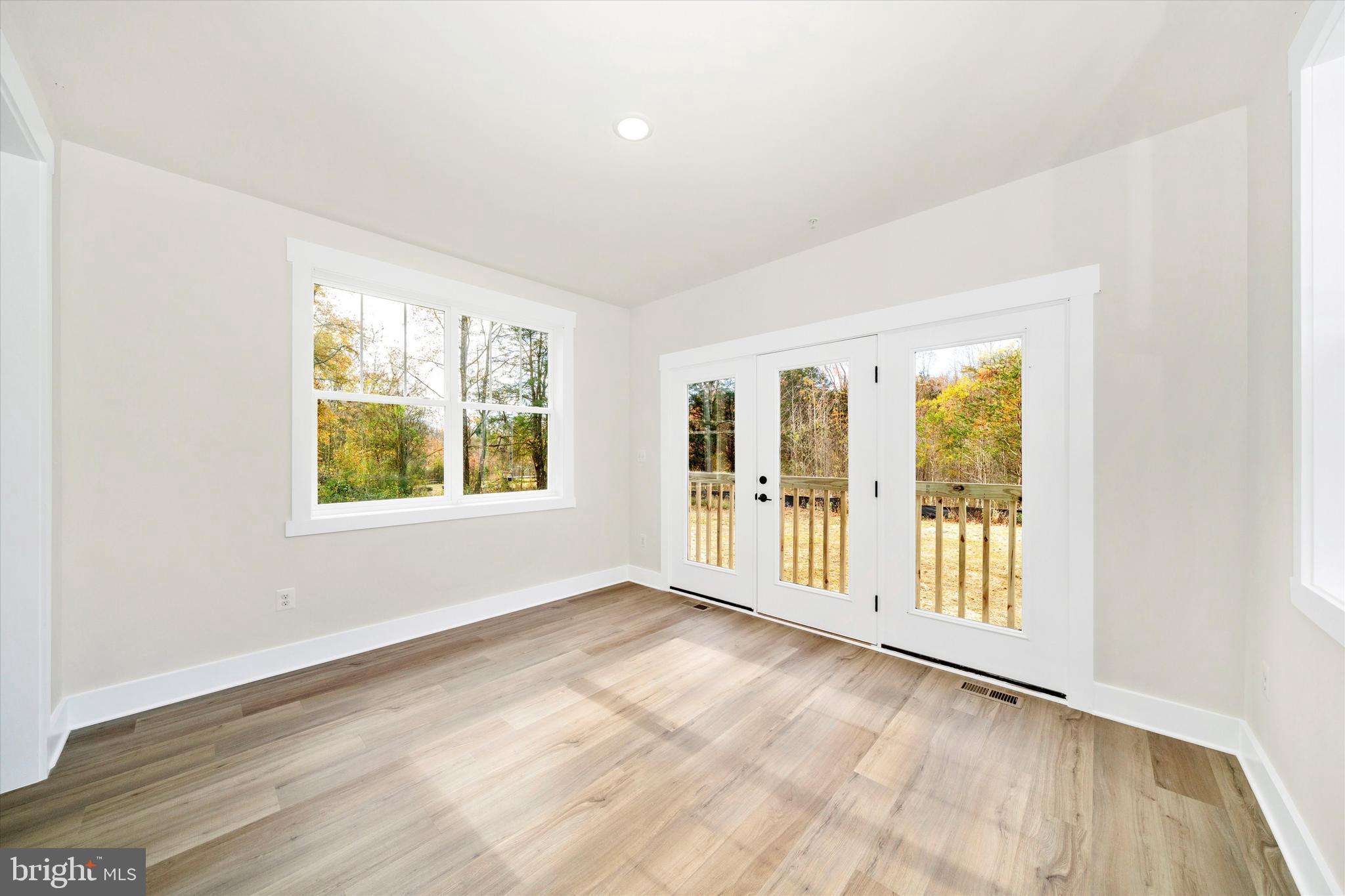 1154 Mt Zion Marlboro Road Lothian, MD 20711 - Photo 26 of 66 an empty room with wooden floor and windows