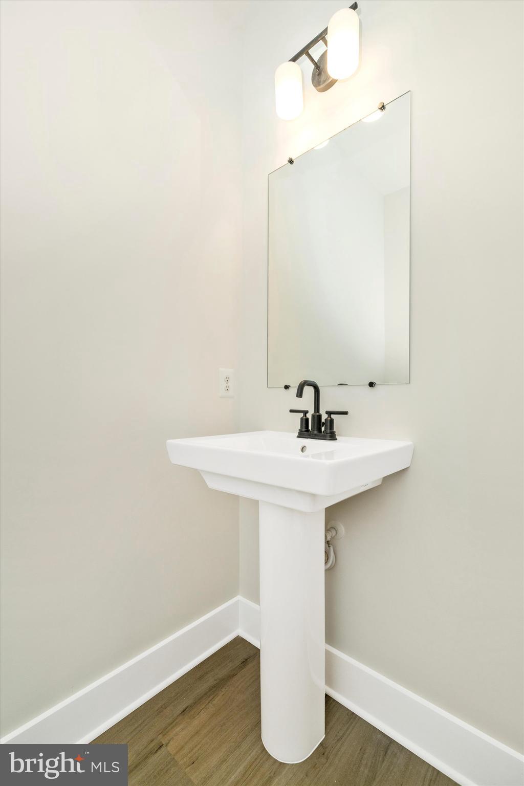 1154 Mt Zion Marlboro Road Lothian, MD 20711 - Photo 28 of 66 a bathroom with a sink and mirror