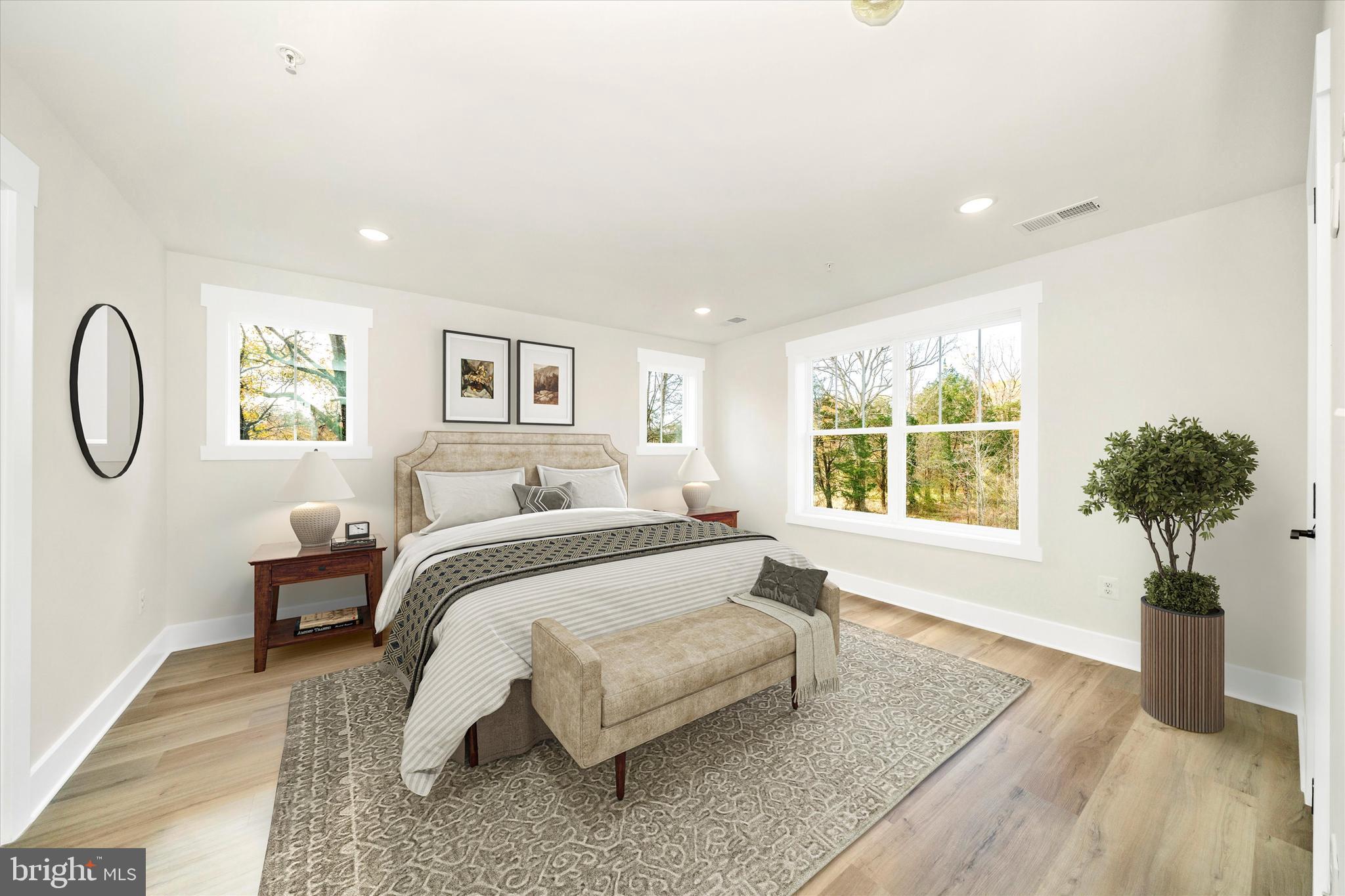 1154 Mt Zion Marlboro Road Lothian, MD 20711 - Photo 29 of 66 a spacious bedroom with a bed a chandelier and a window