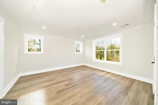 a bathroom with a double vanity sink mirror and shower