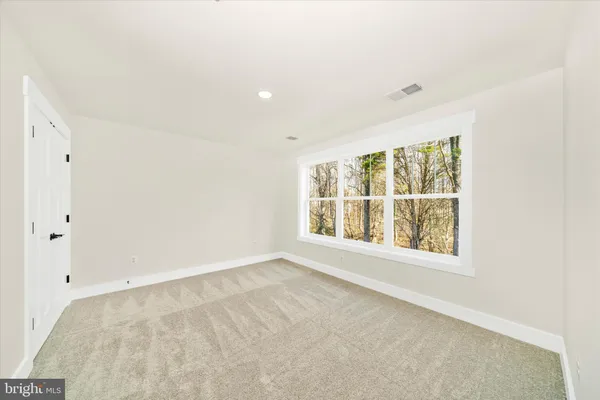 a view of a porch with a table and chairs