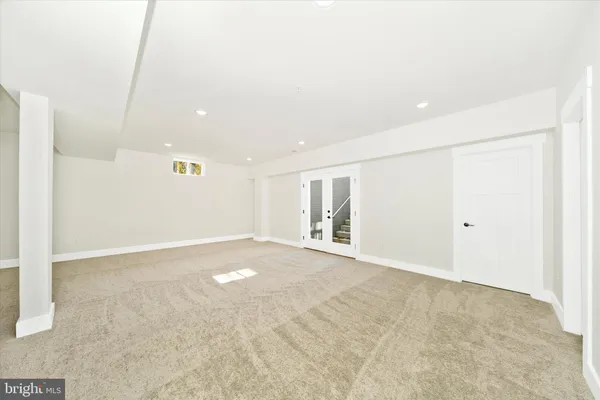 a view of a house with a small yard and wooden floor and fence