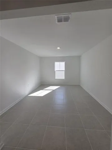 a view of an empty room and window