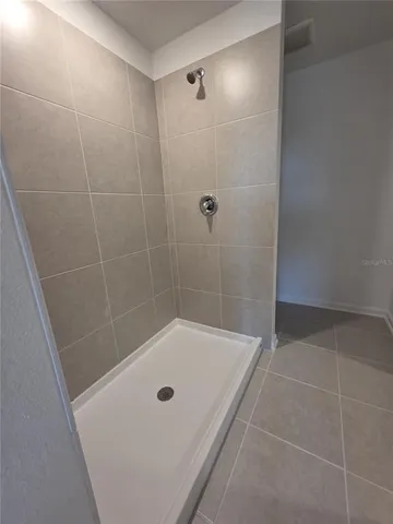 a bathroom with a tub and a shower
