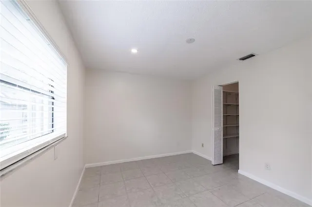 a view of swimming pool with outdoor seating and plants