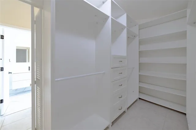 a view of a hallway with a window