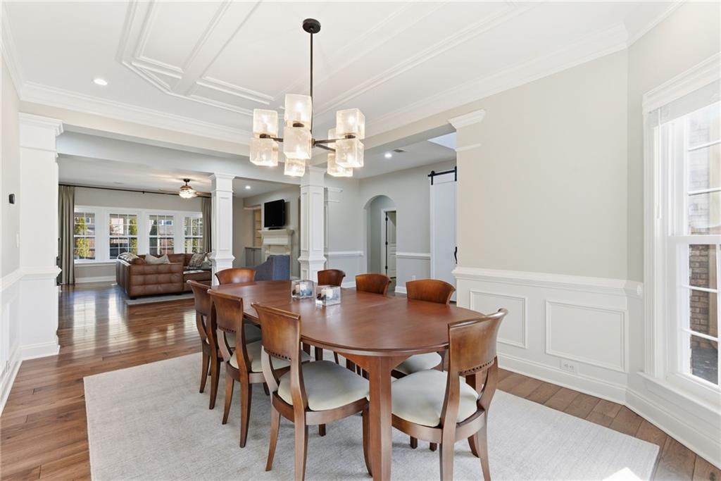 4415 Brampton Way Cumming, GA 30041 - Photo 11 of 59 a view of a dining room with furniture window and wooden floor