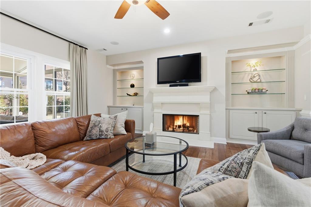 4415 Brampton Way Cumming, GA 30041 - Photo 12 of 59 a living room with furniture fireplace and flat screen tv