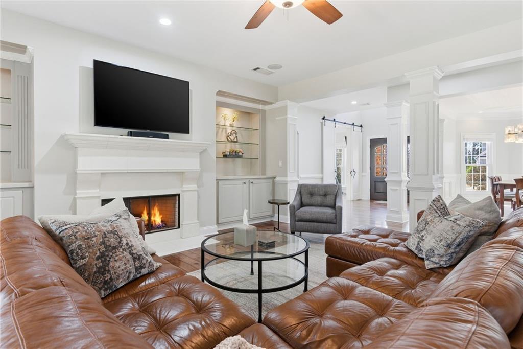 4415 Brampton Way Cumming, GA 30041 - Photo 13 of 59 a living room with furniture and a flat screen tv