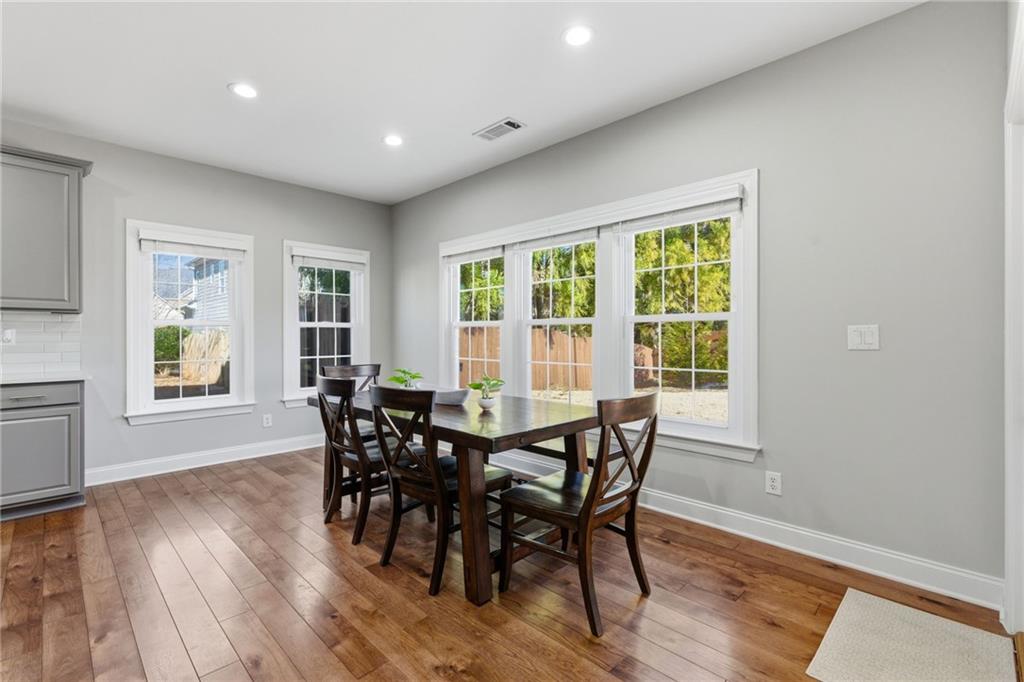 4415 Brampton Way Cumming, GA 30041 - Photo 16 of 59 a view of a dining room with furniture and windows