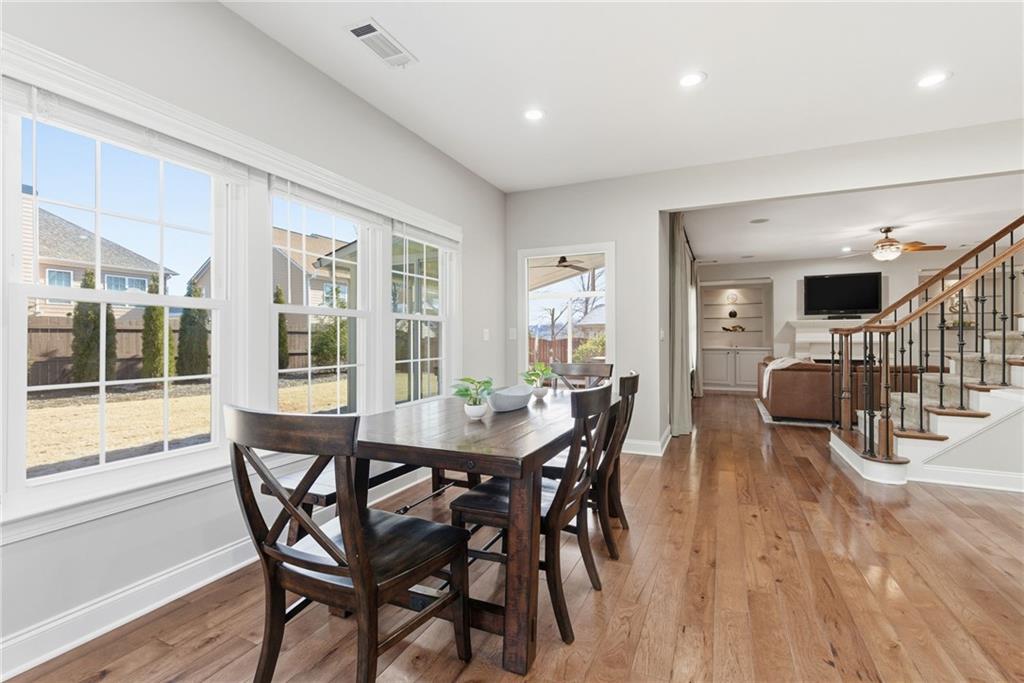 4415 Brampton Way Cumming, GA 30041 - Photo 17 of 59 a view of a dining room with furniture and wooden floor