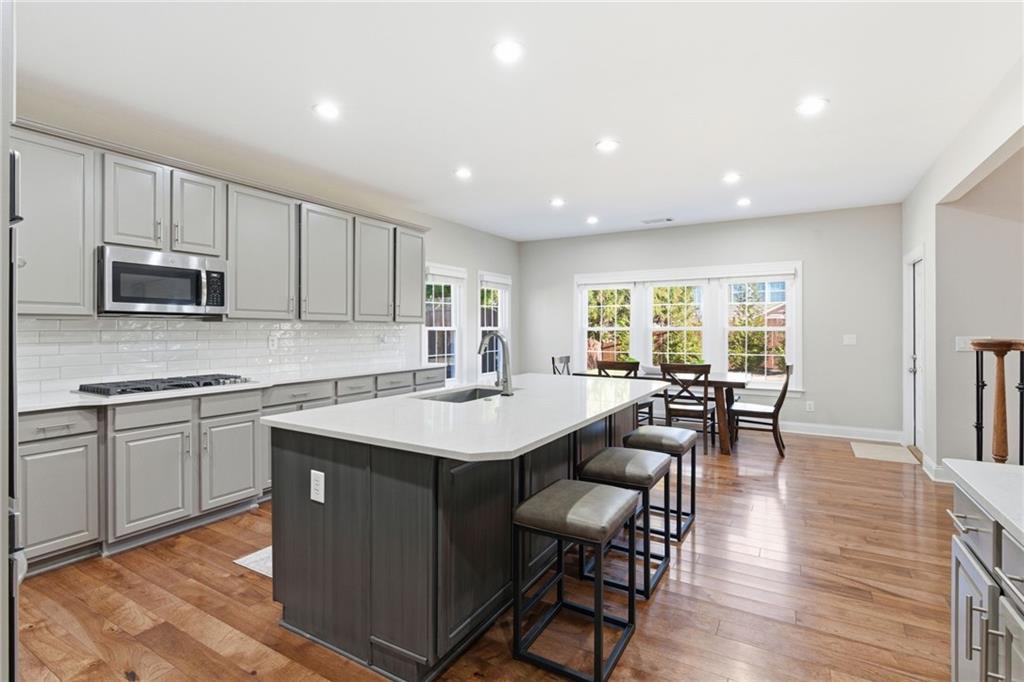 4415 Brampton Way Cumming, GA 30041 - Photo 24 of 59 a kitchen with counter space sink appliances and cabinets
