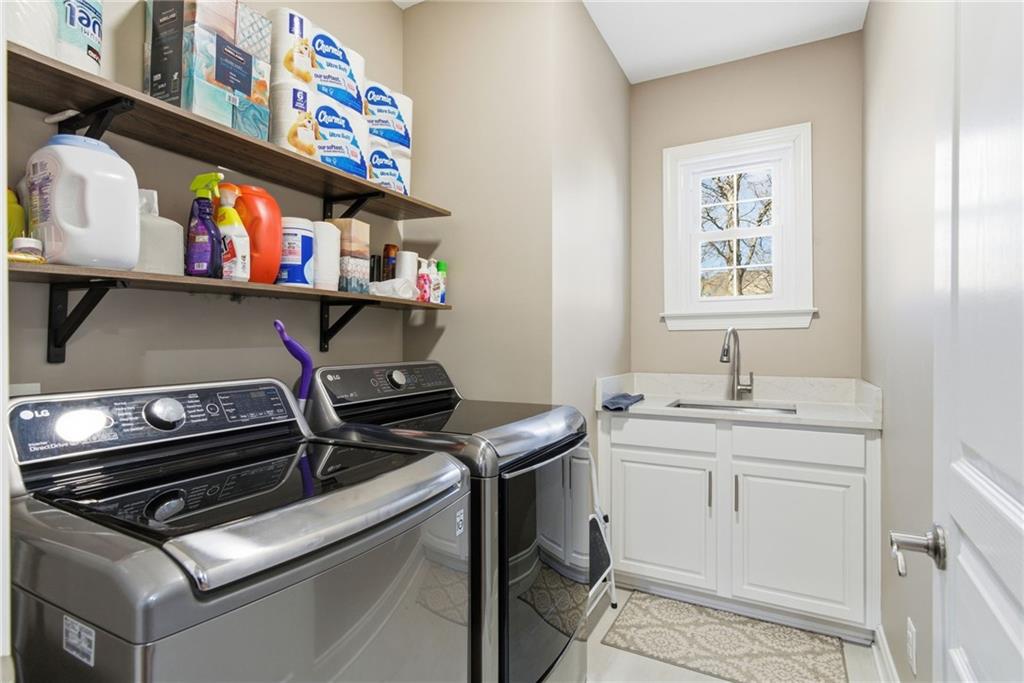 4415 Brampton Way Cumming, GA 30041 - Photo 29 of 59 a utility room with stainless steel appliances and a sink