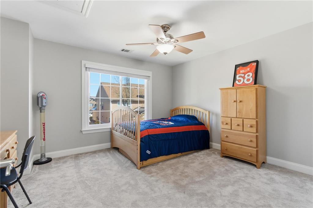 4415 Brampton Way Cumming, GA 30041 - Photo 46 of 59 a living room with furniture and a window