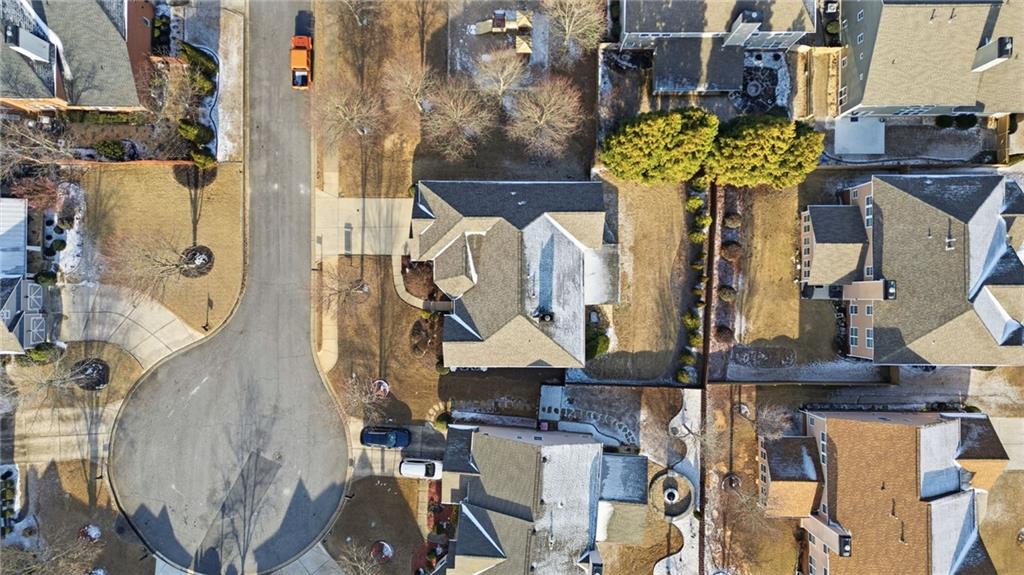 4415 Brampton Way Cumming, GA 30041 - Photo 55 of 59 with a white vase of flowers sitting on a table