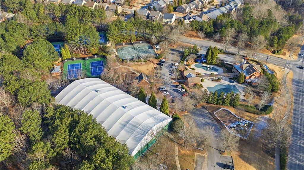 4415 Brampton Way Cumming, GA 30041 - Photo 56 of 59 an aerial view of a house with a yard and large trees