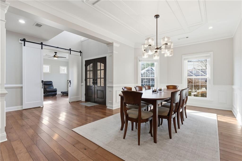 4415 Brampton Way Cumming, GA 30041 - Photo 10 of 59 a view of a dining room with furniture and wooden floor