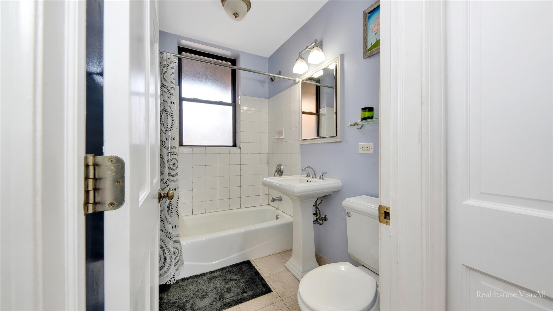 1340 West Irving Park Road, Unit 2 Chicago, IL 60613 - Photo 17 of 25 a bathroom with a sink toilet and shower