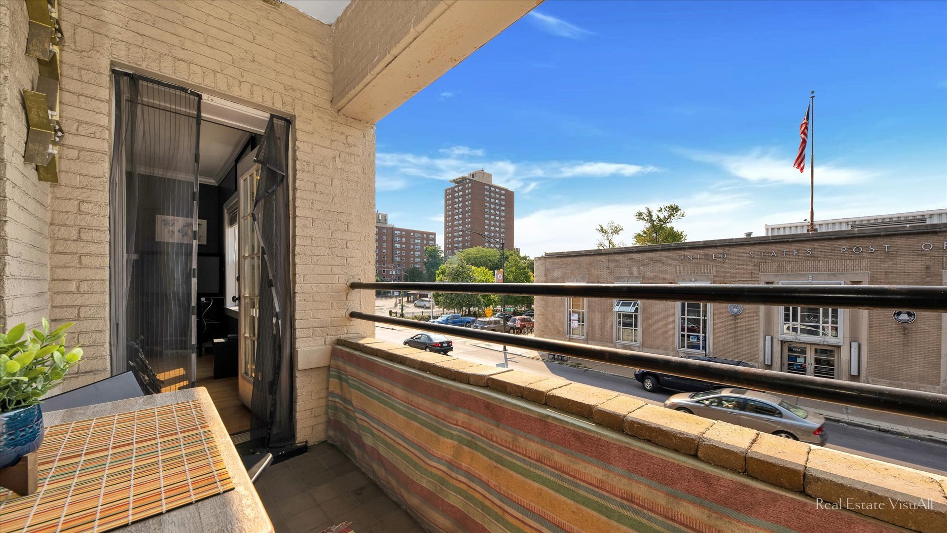 1340 West Irving Park Road, Unit 2 Chicago, IL 60613 - Photo 20 of 25 a roof deck with couch and potted plants