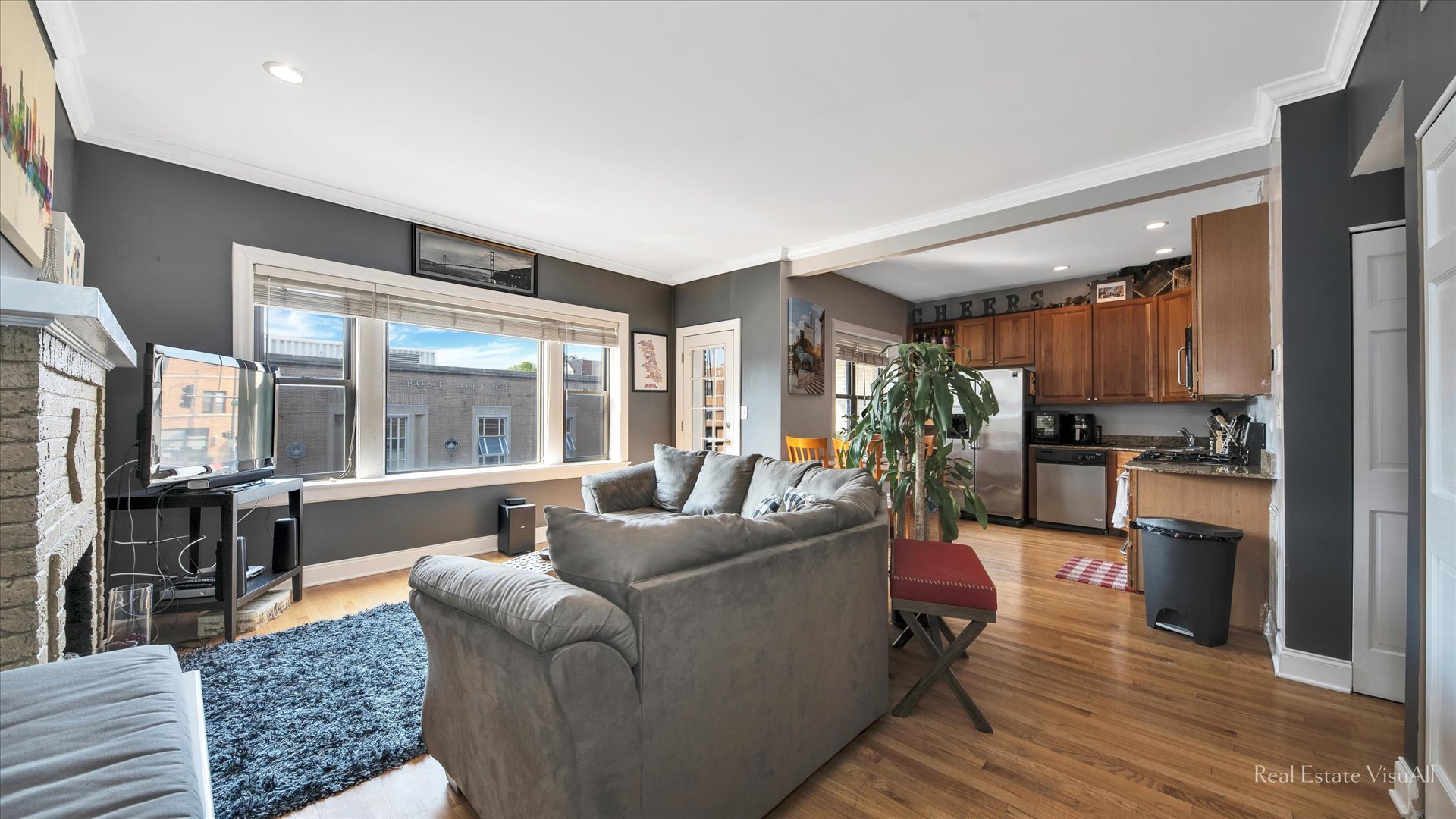 1340 West Irving Park Road, Unit 2 Chicago, IL 60613 - Photo 3 of 25 a living room with furniture and a large window