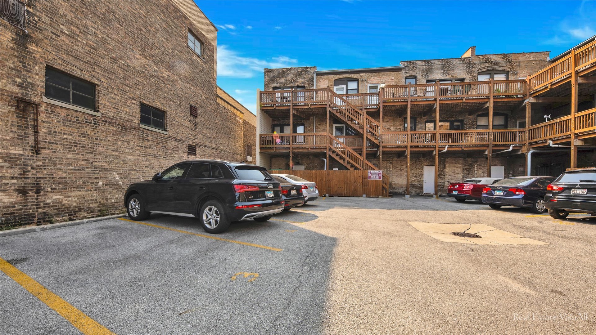 1340 West Irving Park Road, Unit 2 Chicago, IL 60613 - Photo 24 of 25 a car parked in front of a building