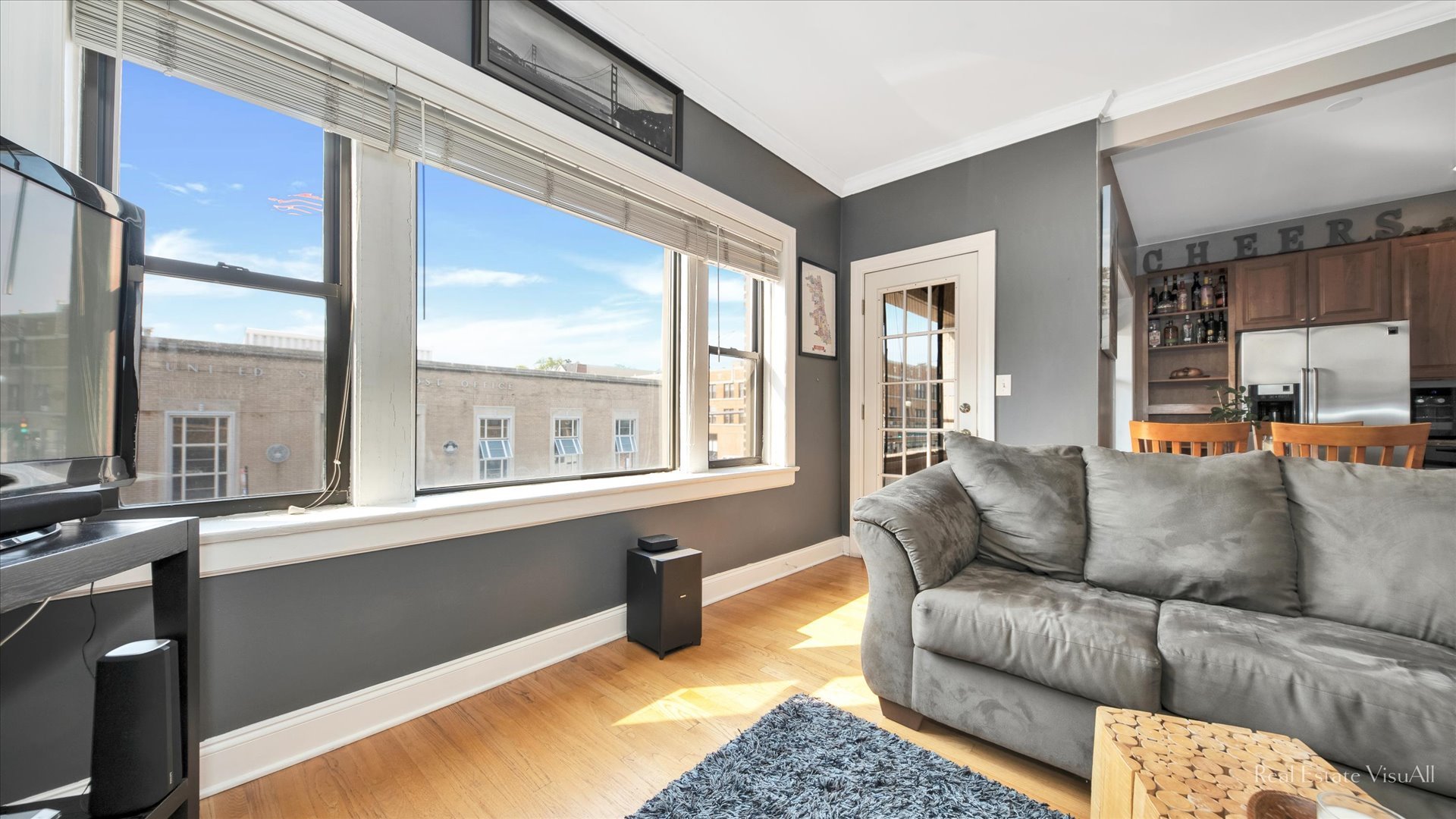 1340 West Irving Park Road, Unit 2 Chicago, IL 60613 - Photo 5 of 25 a living room with furniture and a large window