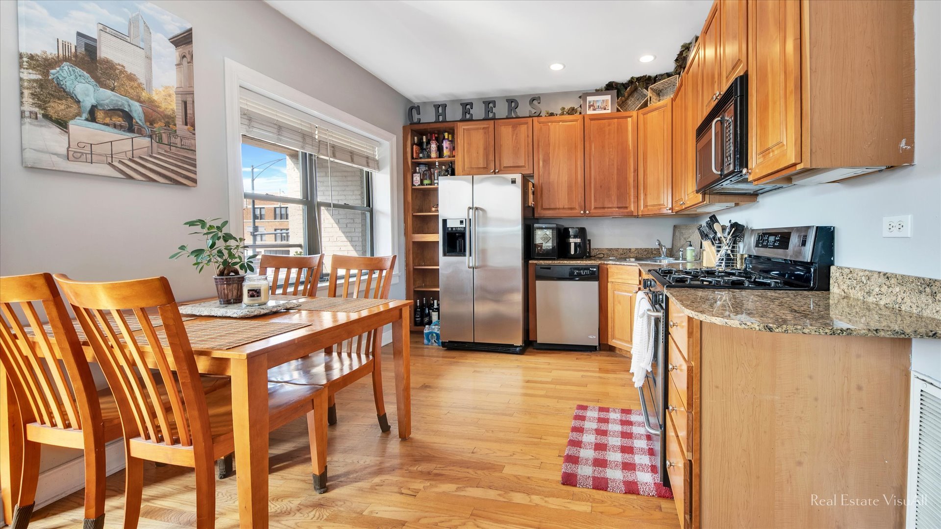 1340 West Irving Park Road, Unit 2 Chicago, IL 60613 - Photo 7 of 25 a kitchen with stainless steel appliances granite countertop a refrigerator a stove top oven a sink and dishwasher