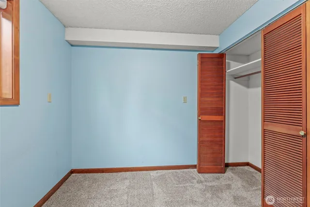 a room with chairs and white walls