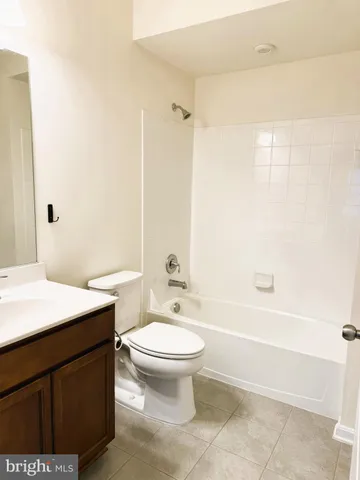 a bathroom with a sink a toilet and a bathtub
