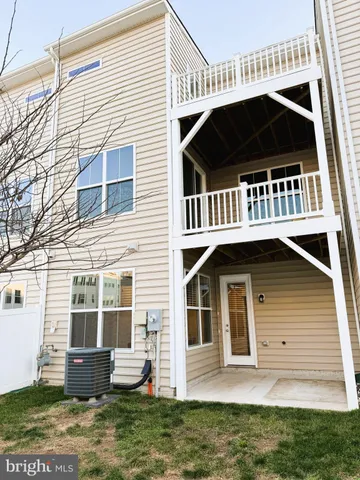a view of a large white building with large windows