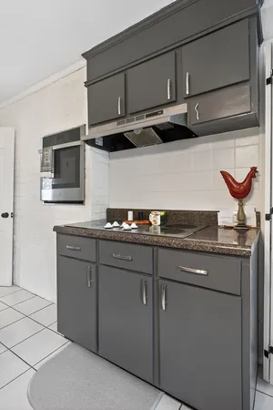 a kitchen with stainless steel appliances granite countertop a sink and a stove