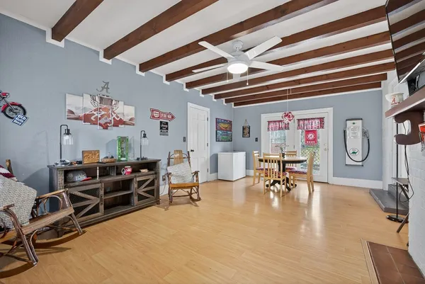a view of a livingroom with furniture and a flat screen tv