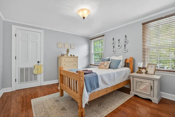 a bed room with a bed and a chair