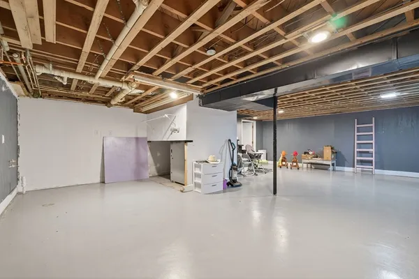 a view of empty room with wooden ceiling