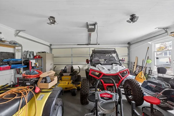 a utility room with dryer washer and other items