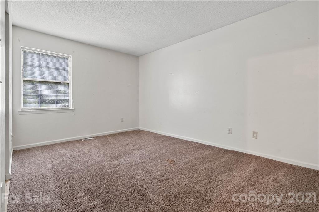 10953 Park Road Charlotte, NC 28226 - Photo 11 of 17 an empty room with windows
