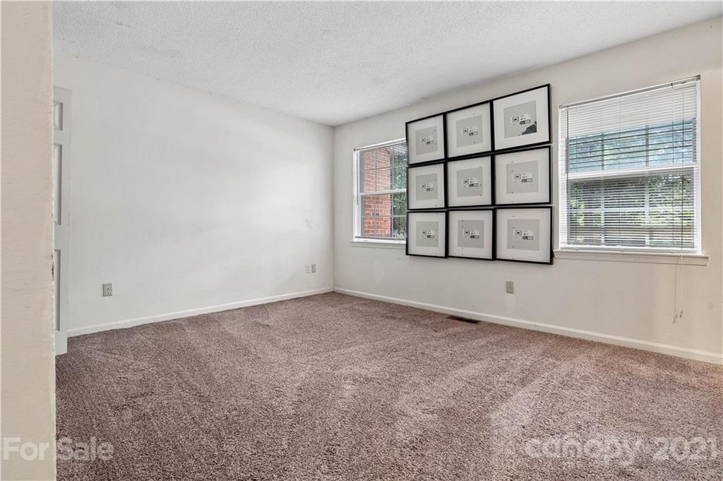 10953 Park Road Charlotte, NC 28226 - Photo 12 of 17 an empty room with windows