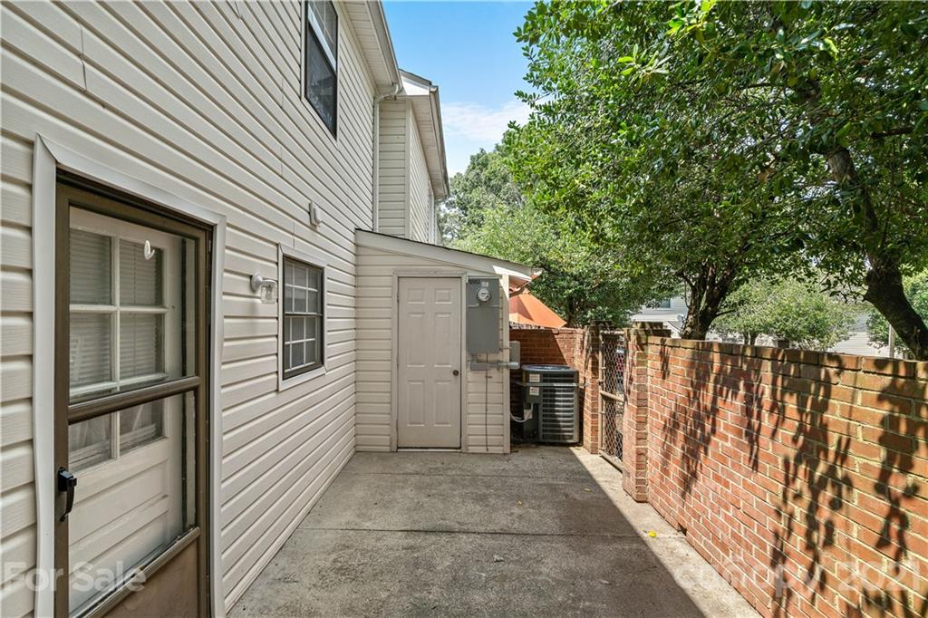 10953 Park Road Charlotte, NC 28226 - Photo 16 of 17 a view of a house with a backyard