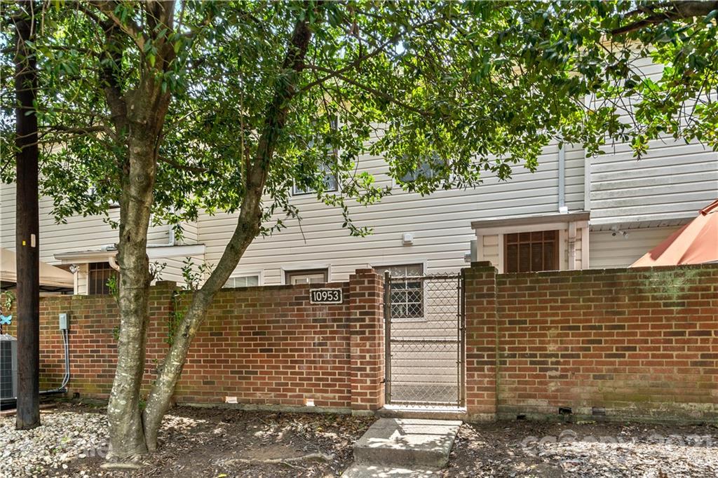 10953 Park Road Charlotte, NC 28226 - Photo 17 of 17 a view of a house with a tree